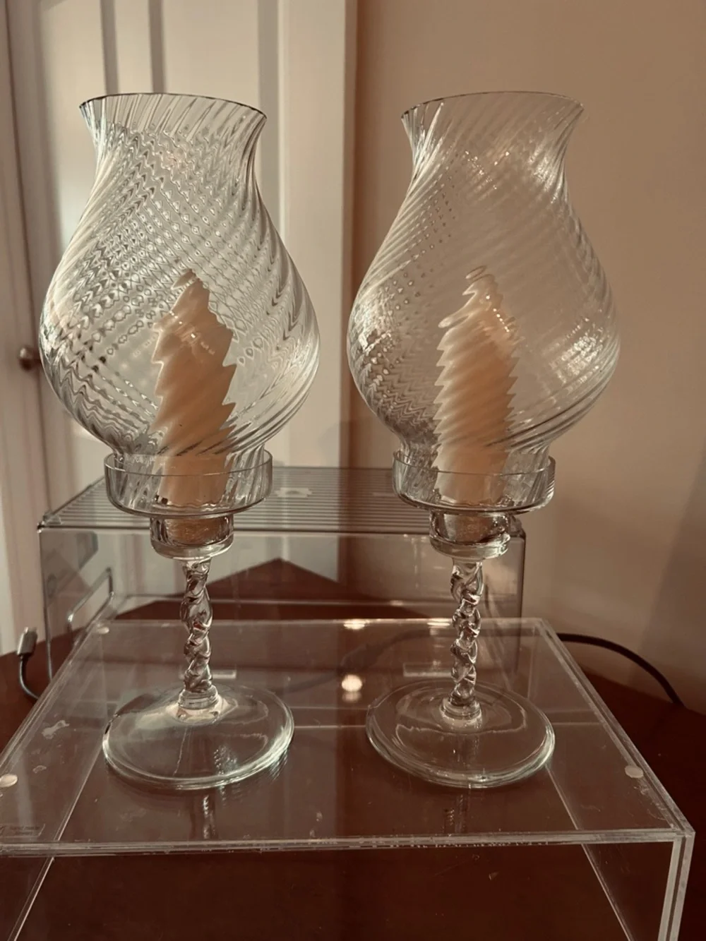 Two crystal candle holders.